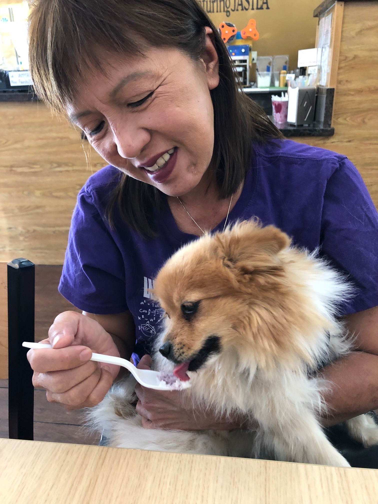 Trang at home with one of her rescue dogs